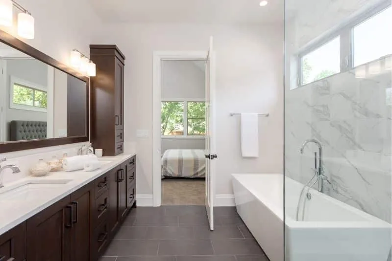 Bathroom with dark timber vanity and marble shower