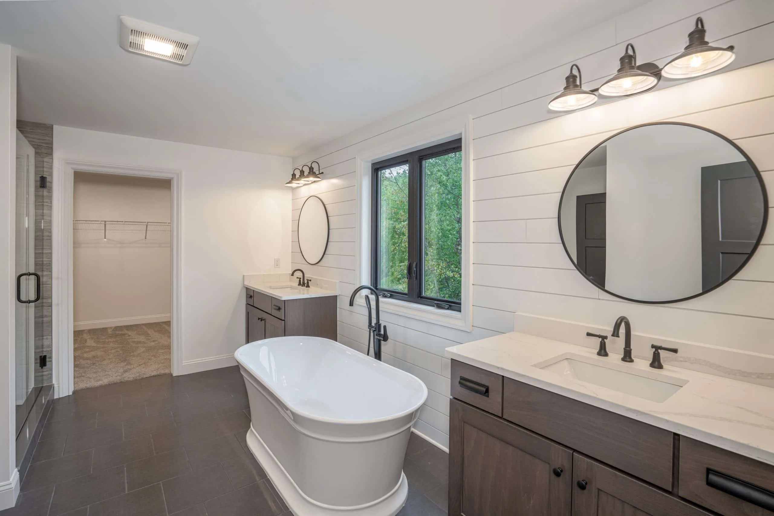 Renovated bathroom with freestanding tub and shower