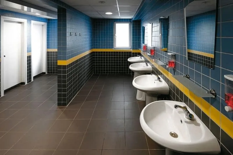 Commercial washroom with row of basins