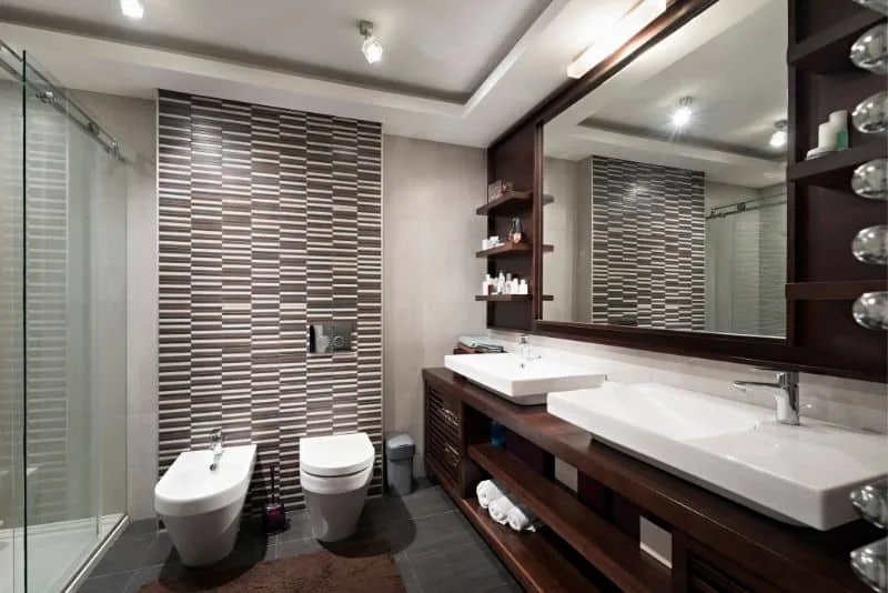Bathroom with dark timber vanity and feature tiles